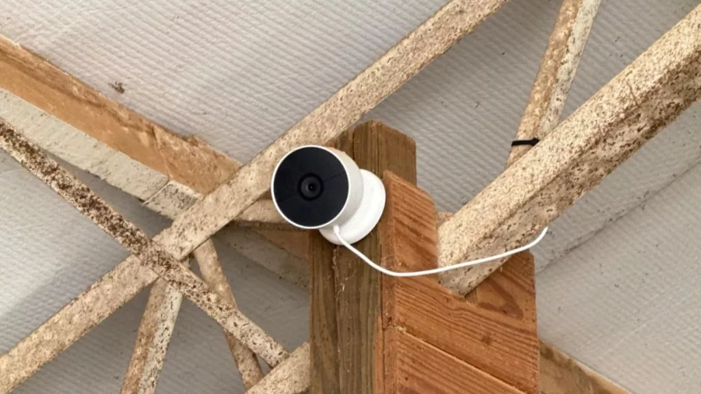 Google Nest Cam mounted in the rafters for elevated smart home security monitoring and wide-angle surveillance.