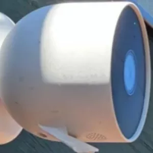 Google Nest Cam (Outdoor) plugged in and actively paired with Alexa for smart home security monitoring.