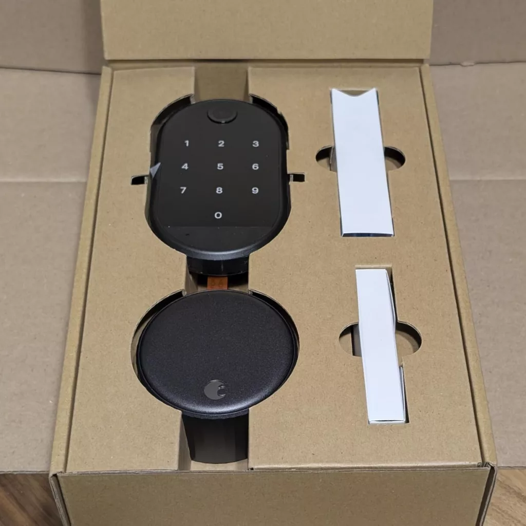 Unboxing the Yale August Wi-Fi Smart Lock, showcasing the sleek design and included components