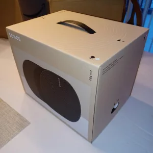 Image of the unopened Sonos Era 300 smart speaker in its original box, showcasing its sleek design and clear Sonos branding